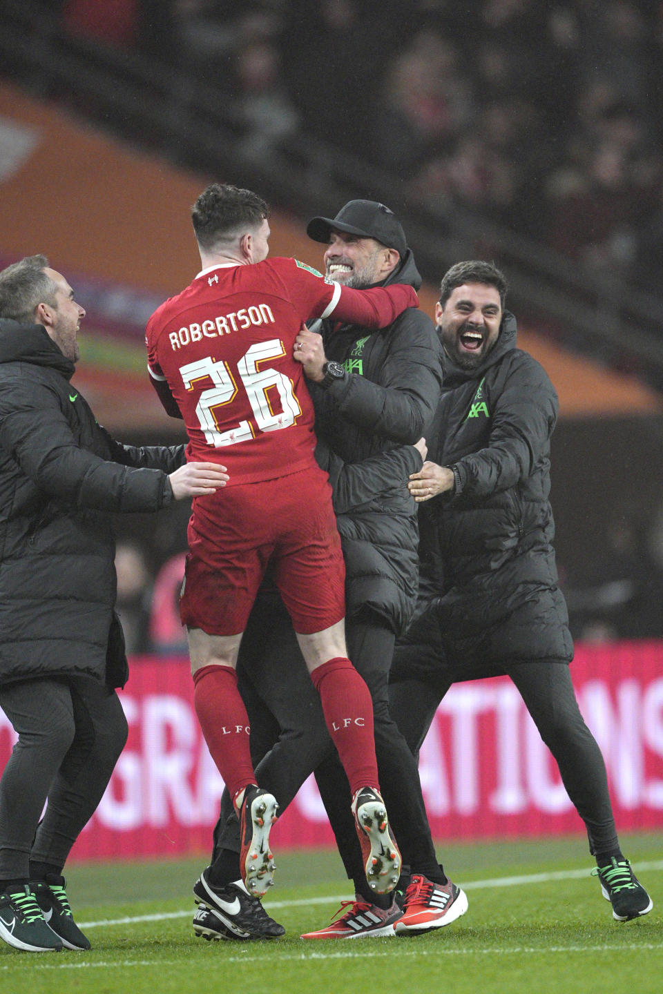 Liverpool's manager Jurgen Klopp, second right, celebrates with Liverpool's Andrew Robertson during the English League Cup final soccer match between Chelsea and Liverpool at Wembley Stadium in London, Sunday, Feb. 25, 2024. (AP Photo/Dave Shopland)