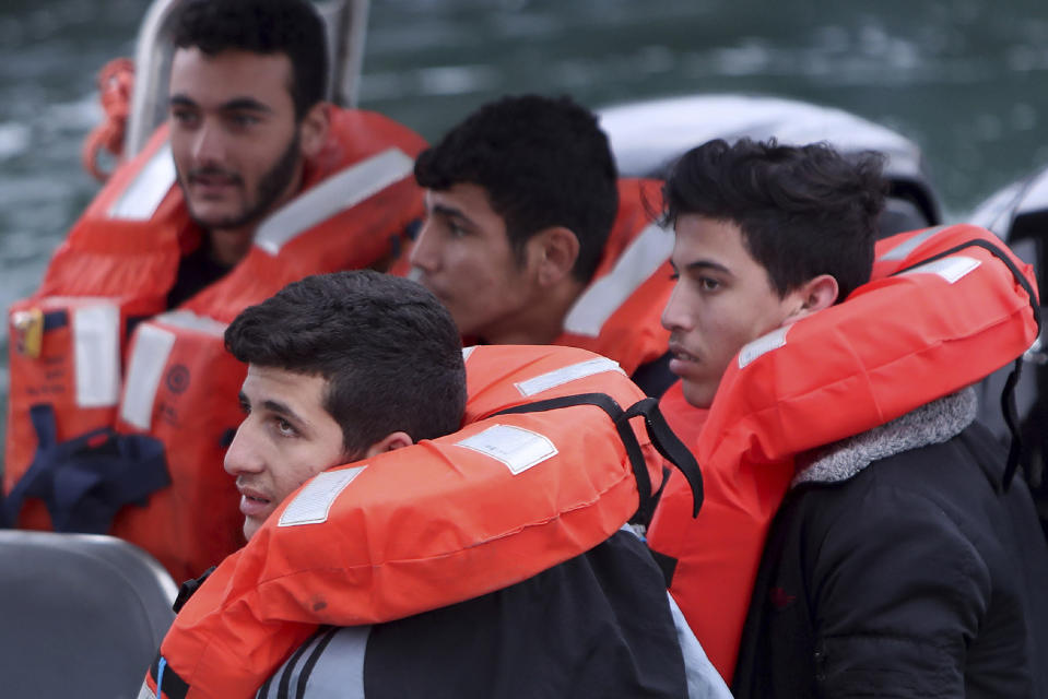 FILE - Migrants aboard a Cyprus marine police boat as they are brought to harbour after being rescued from their own vessel off the Mediterranean island nation's southeastern coast, at Protaras, Cyprus, on Jan. 14, 2020. The United Nations agency for refugees says on Friday, April 29, 2024, Cypriot efforts at sea to stop numerous Syrian refugee-laden boats departing Lebanon from reaching the European Union-member island nation mustn't contravene international human rights laws. (AP Photo/Petros Karadjias, File)