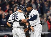 Oct 17, 2017; Bronx, NY, USA; New York Yankees relief pitcher Aroldis Chapman (54) and designated hitter Gary Sanchez (24) celebrate after defeating the Houston Astros in game four of the 2017 ALCS playoff baseball series at Yankee Stadium. Yankees won 6-4. Mandatory Credit: Robert Deutsch-USA TODAY Sports