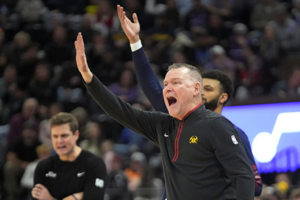 Denver Nuggets head coach Michael Malone shouts to his team during the first half of an NBA basketball game against the Utah Jazz Wednesday, Jan. 10, 2024, in Salt Lake City. (AP Photo/Rick Bowmer)