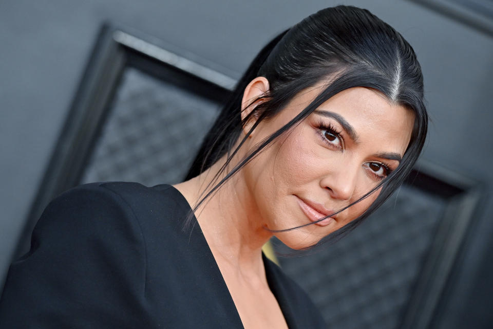 Why are people talking about Kourtney Kardashian Barker's pregnancy? (Photo by Axelle/Bauer-Griffin/FilmMagic)