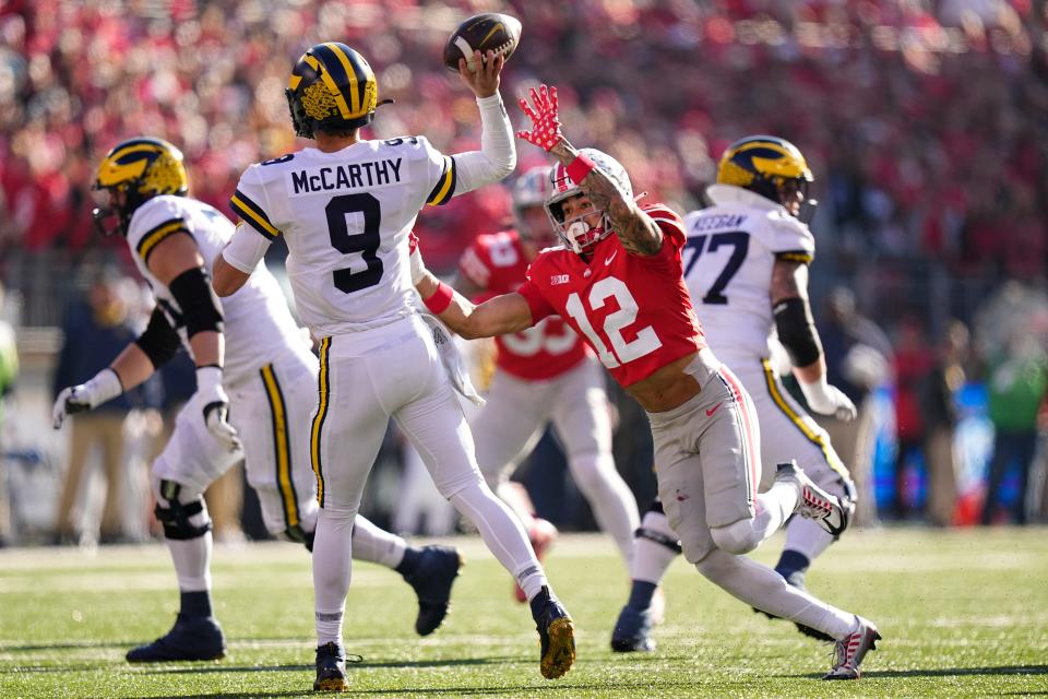 Nov 26, 2022; Columbus, Ohio, USA;  Ohio State Buckeyes safety Lathan Ransom (12) pressures Michigan Wolverines quarterback J.J. McCarthy (9) during the first half of the NCAA football game at Ohio Stadium. Mandatory Credit: Adam Cairns-The Columbus Dispatch