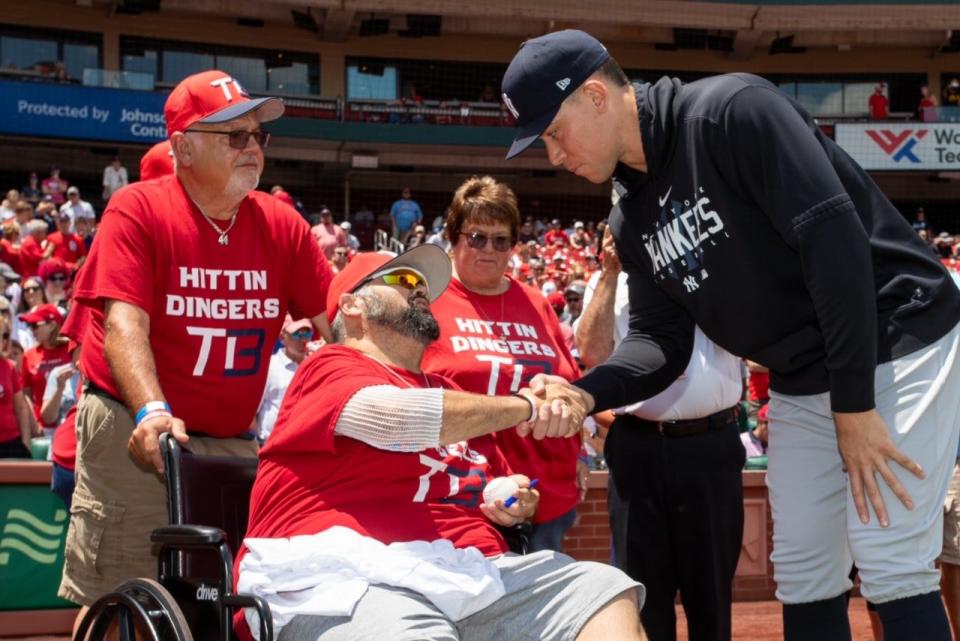 Yankees player Aaron Judge shakes hands with Terry Badger II at the Cardinals game Sunday. Badger's son, Terry Badger III, was remembered in a pre-game ceremony.