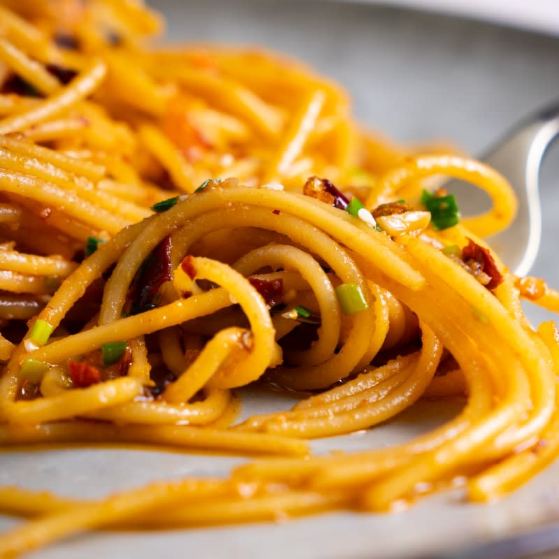 <p>Marion's Kitchen</p><p>You don't have to restrict the use of chili crisp to just Chinese cuisine. Here's a great example of a delicious Spaghetti recip</p><p><strong>Get the recipe here: <a href="https://www.marionskitchen.com/chilli-crisp-garlic-butter-spaghetti/" rel="nofollow noopener" target="_blank" data-ylk="slk:Chili Crisp Garlic Butter Spaghetti;elm:context_link;itc:0;sec:content-canvas" class="link ">Chili Crisp Garlic Butter Spaghetti</a></strong></p>