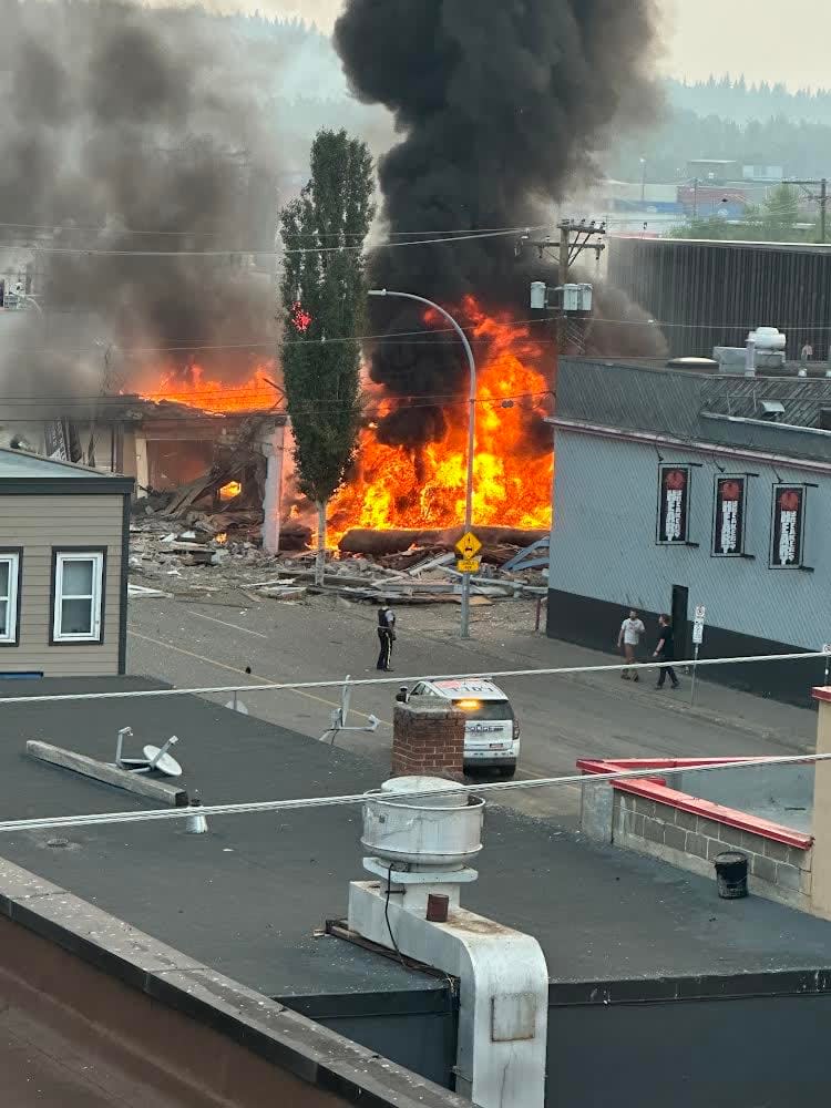 A building has been engulfed by fire in downtown Prince George, B.C. (Shane Trobacher - image credit)