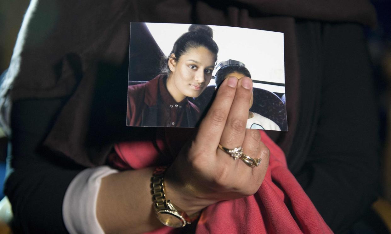 <span>‘It’s hard to conceive of what grooming and trafficking mean, if not what happened to Begum.’ A photograph of Shamima being held by her sister, Renu, 2015.</span><span>Photograph: Laura Lean/AFP/Getty Images</span>