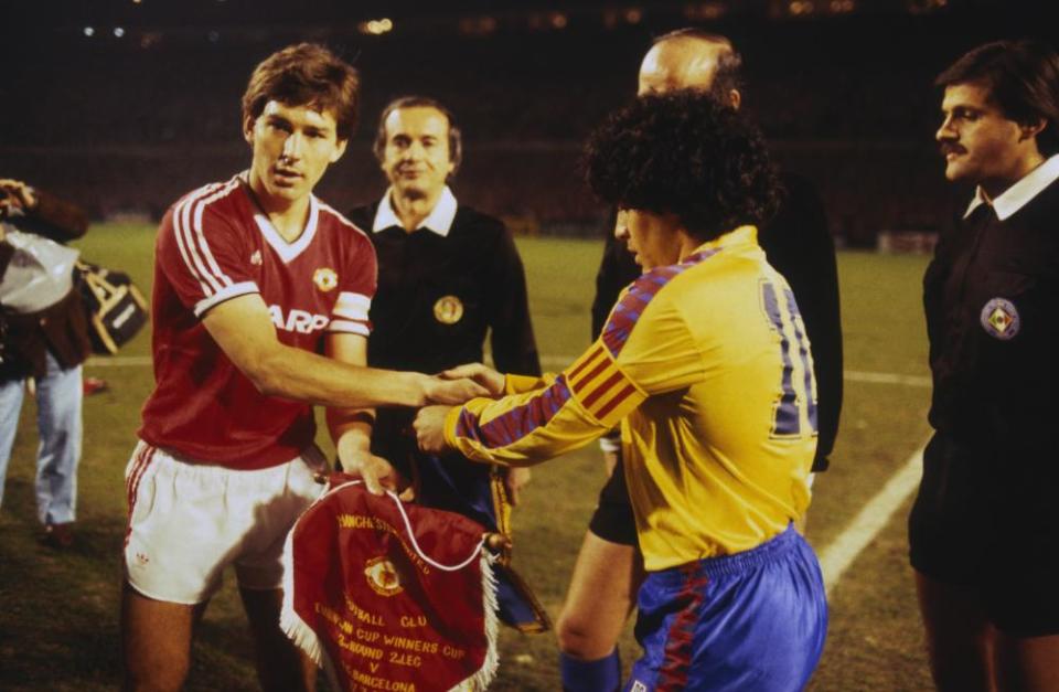 Bryan Robson shakes hands with Diego Maradona before the European Cup Winners’ Cup quarter-final second leg in March 1984.