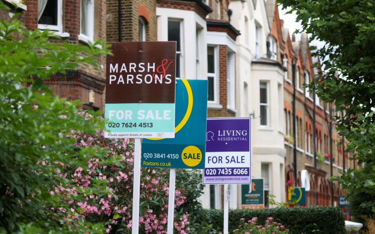 "For Sale" signs outside residential properties in the Queen's Park district of London - Hollie Adams/Bloomberg