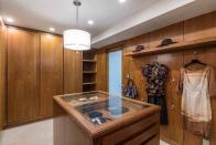 7) Of course, there's a spacious closet with walnut cabinetry.