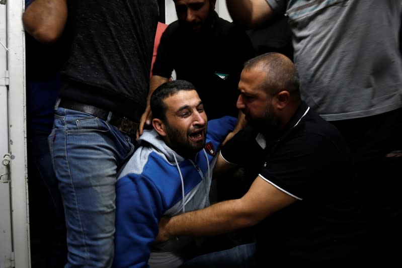 Palestinian mourns after his relative was killed in Gaza