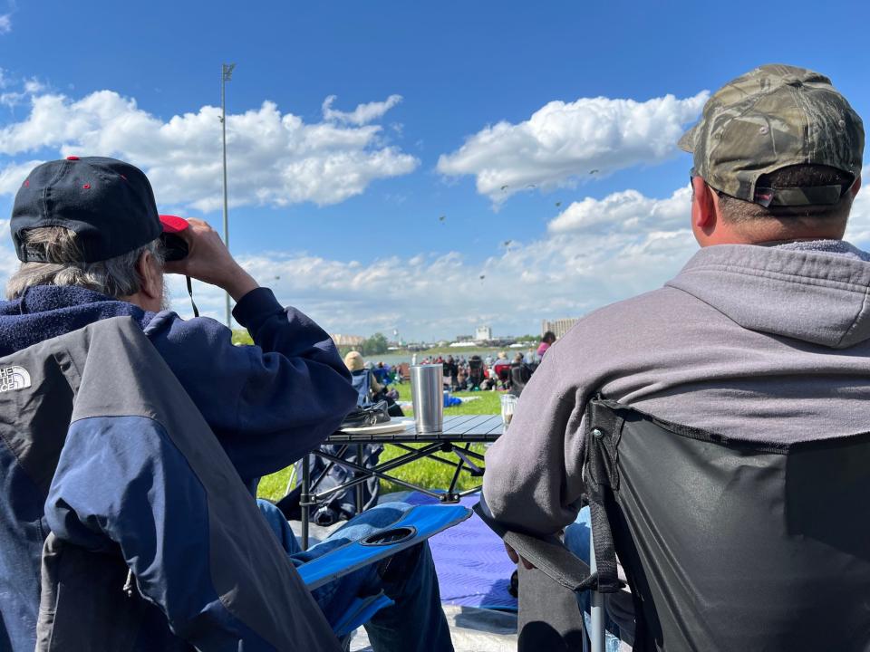 Richard and Fred Fuchs sit at Waterfront Park to watch Thunder Over Louisville airshow on Saturday, April 22, 2023.