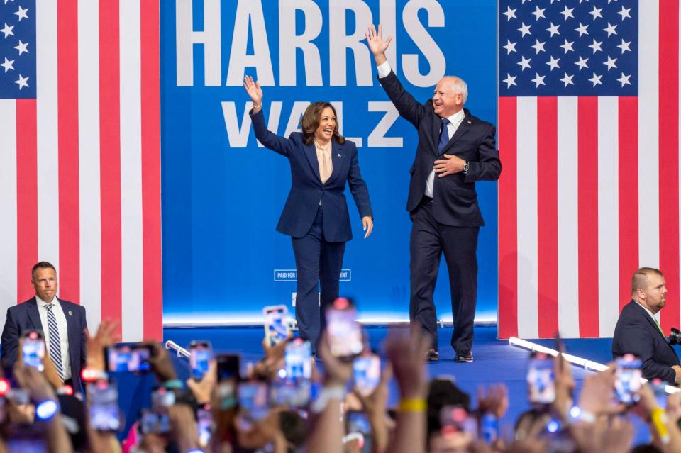 Tim Walz and Kamala Harris at the event for Democratic presidential candidates