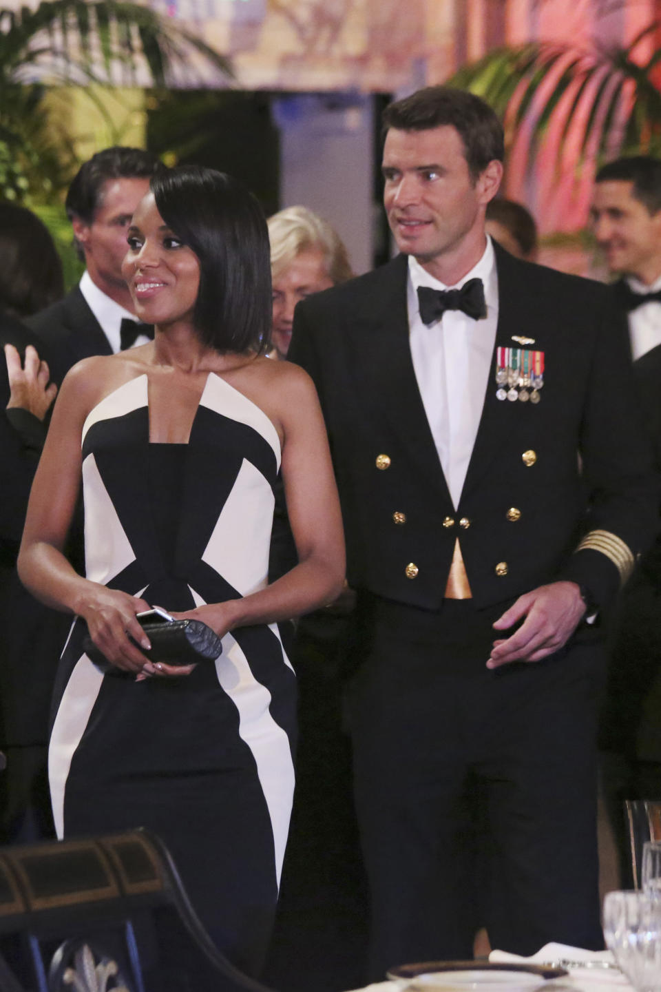 FILE - In this image released by ABC actress Kerry Washington wears a Rubin Singer gown, left, with Scott Foley in a scene from "Scandal." In the realm where Hollywood meets fashion, Kerry Washington is royalty. On her hit show "Scandal," playing professional fixer Olivia Pope, she was all professional Washington _ Washington, D.C., that it _ but on the red carpet, she was glamour personified. (AP Photo/ABC, Richard Cartwright)