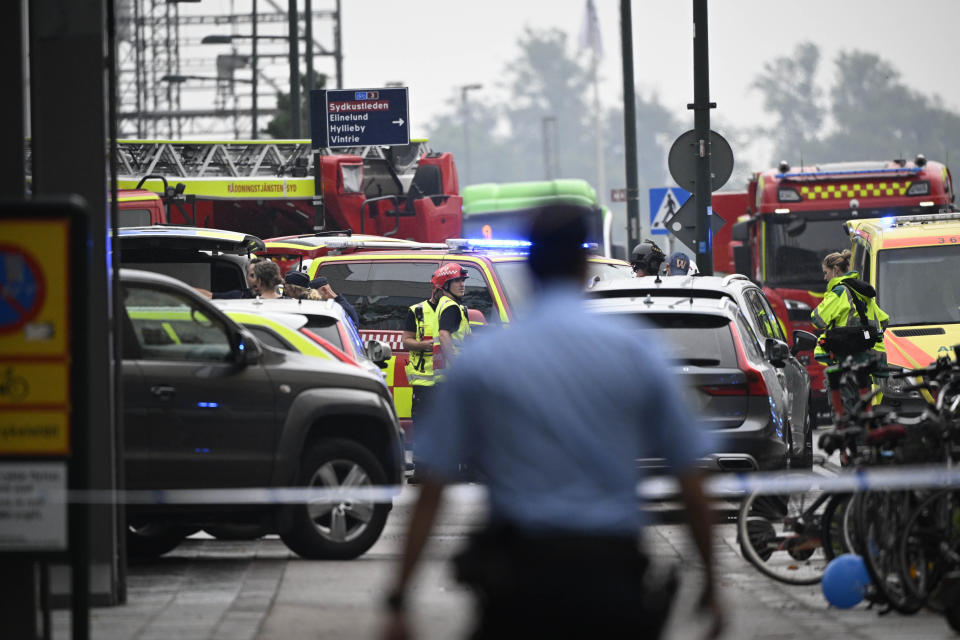 Police officers cordon off the area of a shooting outside the Emporia shopping center in Malmo, Sweden, Friday, Aug. 19, 2022. (Johan Nilsson/TT News Agency via AP)