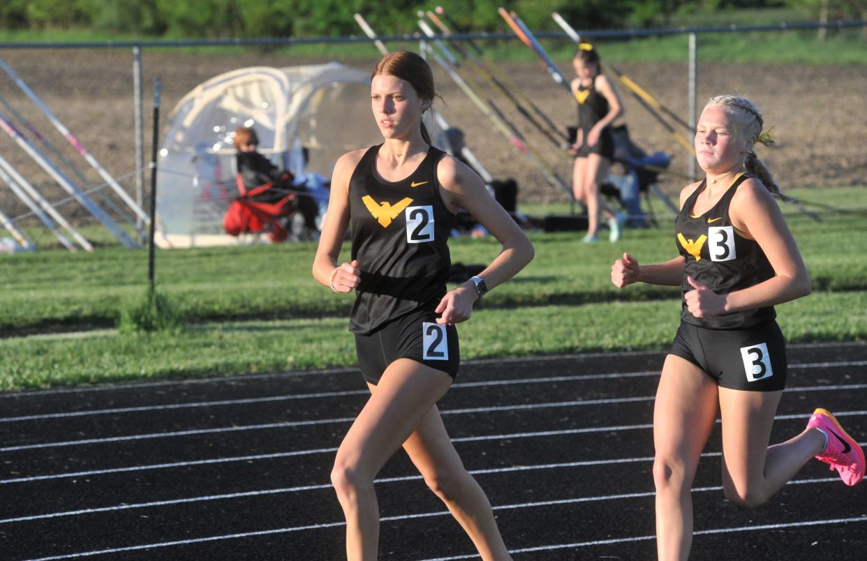 Colonel Crawford's Rylinn Edgington and Brynn Bruner run the two-mile at the Northern 10 track championships.