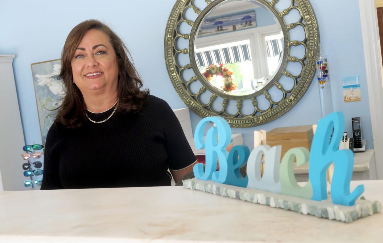 Broadway Court Motel owner Lisa Sassman is shown in the lobby at the Point Pleasant Beach motel Thursday, September 5, 2024. The 1950s-era motel was taken over by Sassman and her husband Mike two years ago and fully renovated with charming upgrades.