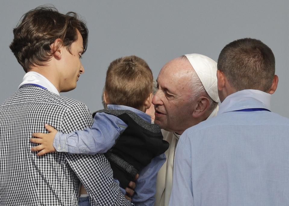 Pope Francis kisses a child during a meeting with young people and families, in Iasi, Romania, Saturday, June 1, 2019. Francis began a three-day pilgrimage to Romania on Friday that in many ways is completing the 1999 trip by St. John Paul II that marked the first-ever papal visit to a majority Orthodox country. (AP Photo/Andrew Medichini)