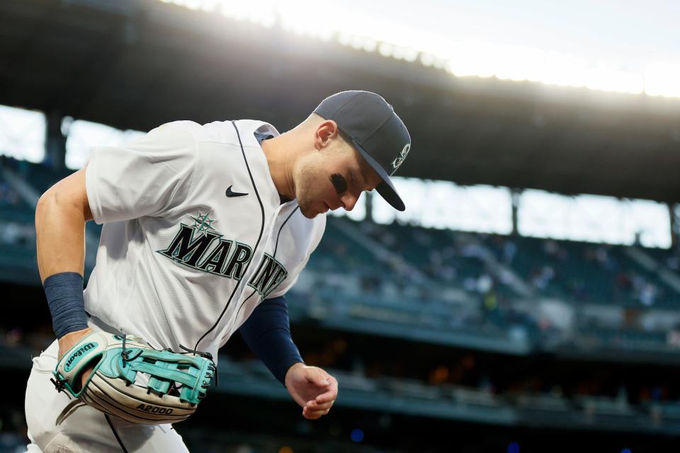 Seattle Mariners outfielder Jarred Kelenic makes his way onto the field against Cleveland at T-Mobile Park on May 13, 2021, for his major league debut.