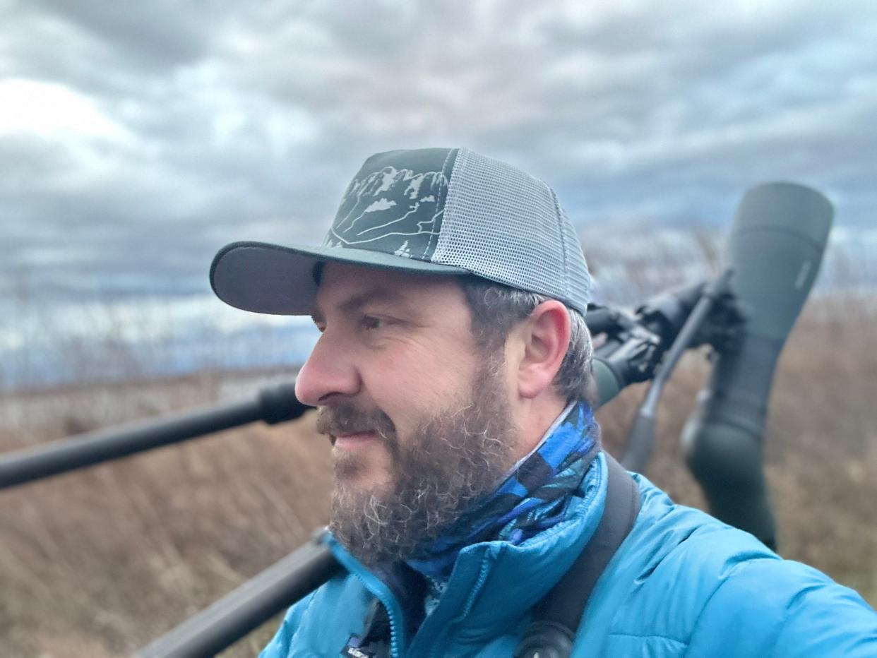 Goshen College grad Drew Weber, who works as project manager for the Merlin Bird ID App, looks for birds in Lost Maples State Natural Area in Texas.