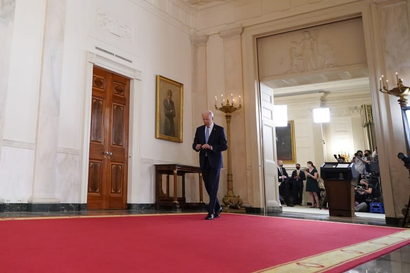 President Joe Biden walks from the podium after speaking about the end of the war in Afghanistan from the State Dining Room of the White House, Tuesday, Aug. 31, 2021, in Washington. (AP Photo/Evan Vucci)