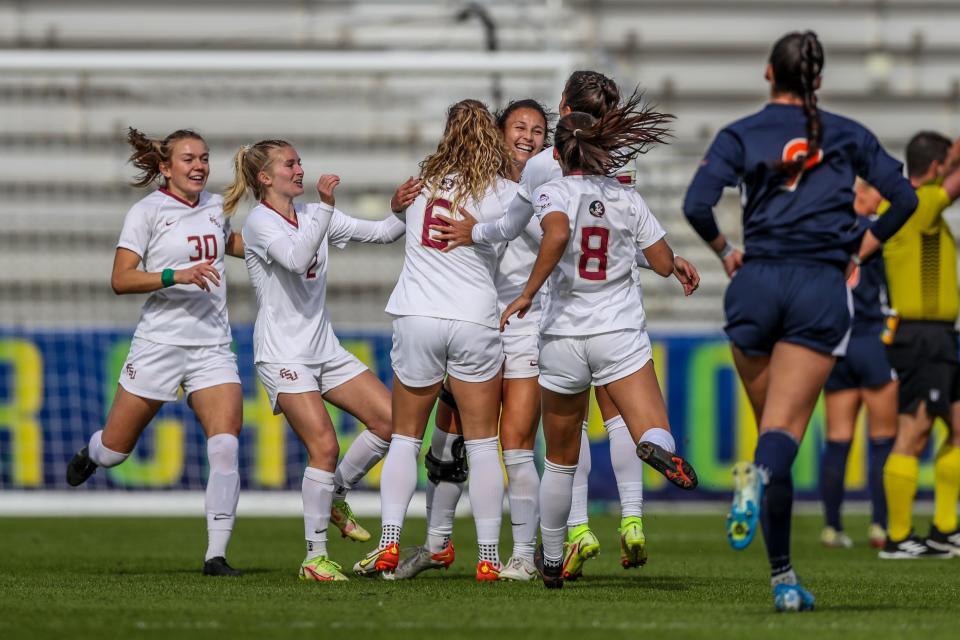 Florida State players celebrate with Clara Robbins' following her first-half goal against Virginia Sunday in the ACC Championship.