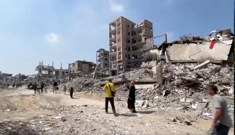 In this image taken from video, Palestinians returned to scenes of destruction in Gaza City's Shijaiyah neighborhood on Thursday, July 11, 2024, after Israeli troops withdrew following a two-week offensive. (AP Photo)