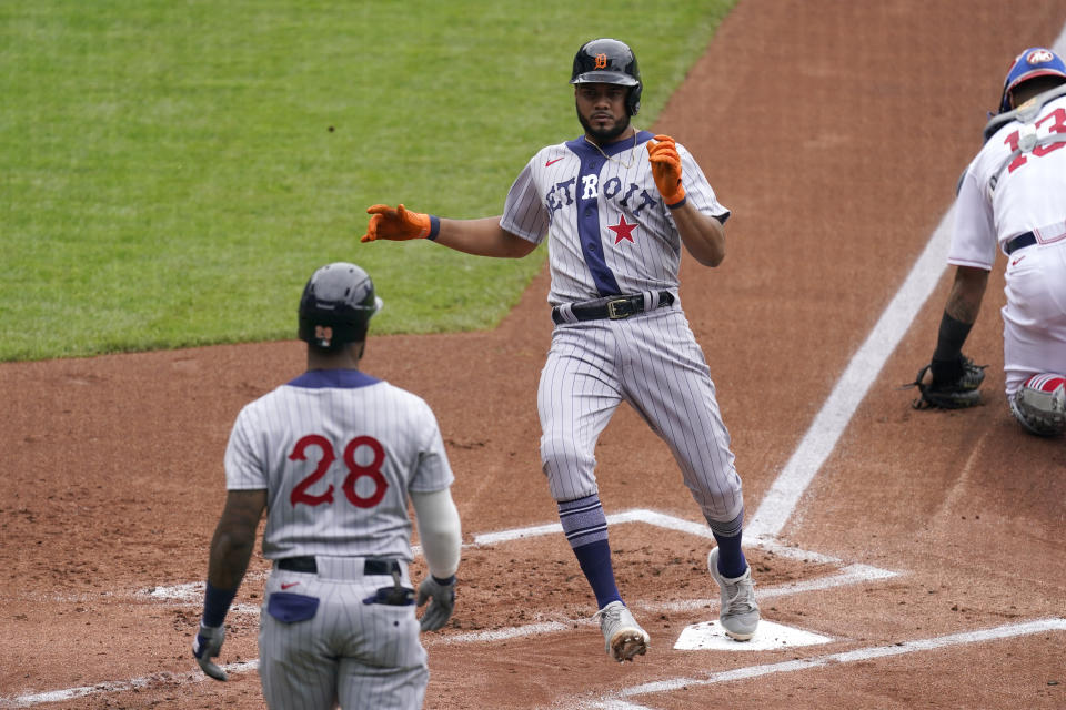 Detroit Tigers' Jeimer Candelario runs home to score on an RBI single by Eric Haase during the first inning of a baseball game against the Kansas City Royals Sunday, May 23, 2021, in Kansas City, Mo. (AP Photo/Charlie Riedel)