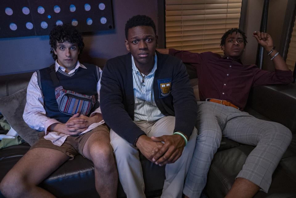 Sebastian Chacon, Donald Elise Watkins, and RJ Cyler sit on a couch