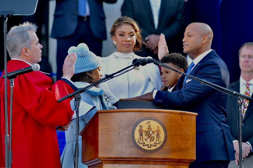 Wes Moore rests his left hand on a Bible once owned by Marylander and famed abolitionist Frederick Douglass while taking the oath of office to become the state's 63rd governor Wednesday in Annapolis. Moore, joined by his wife, Dawn, and children, Mia and James, was sworn in by Maryland Supreme Court Chief Justice Matthew J. Fader, left. Moore is the state's first Black governor, and only the third Black person to be elected a governor in the history of the United States. For more coverage, visit www.heraldmailmedia.com or check out Friday's newspaper.
