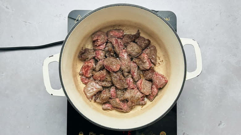 browning beef in pot