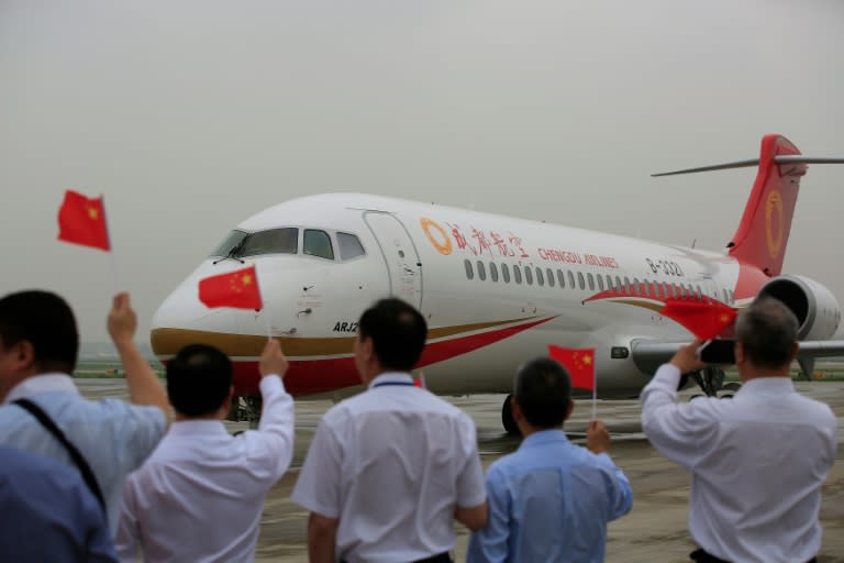 China's first domestically produced regional jet, ARJ21, arrives at Shanghai Hongqiao Airport after making its inaugural flight, from Chengdu, on June 28, 2016