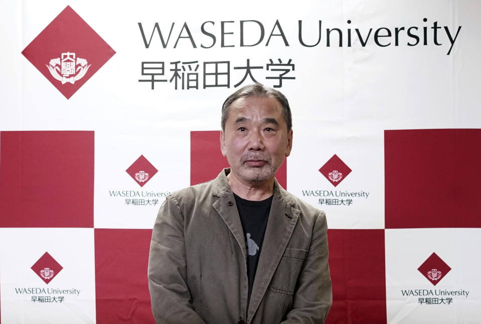 Japanese novelist Haruki Murakami poses for photographers during a press conference at Waseda University in Tokyo Saturday, Nov. 3, 2018. (AP Photo/Eugene Hoshiko)