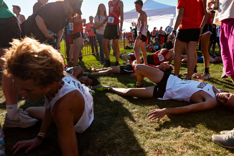 Runner lay on the ground after competing in the 3A state high school cross-country championships at the Regional Athletic Complex in Salt Lake City on Tuesday, Oct. 24, 2023. | Megan Nielsen, Deseret News