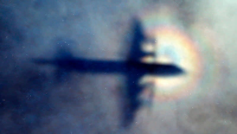In this March 31, 2014, file photo, the shadow of a Royal New Zealand Air Force P3 Orion is seen on low level cloud while the aircraft searches for missing Malaysia Airlines Flight MH370 in the southern Indian Ocean, near the coast of Western Australia. Netflix will release a documentary, “MH370: The Plane That Disappeared,” about the incident on March 8.