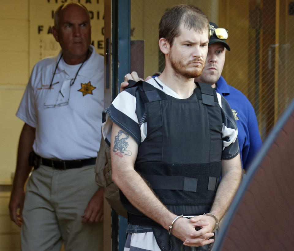 Timothy Ray Jones Jr is escorted to prison after being accused of killing his five young children in their South Carolina home. Source: AP