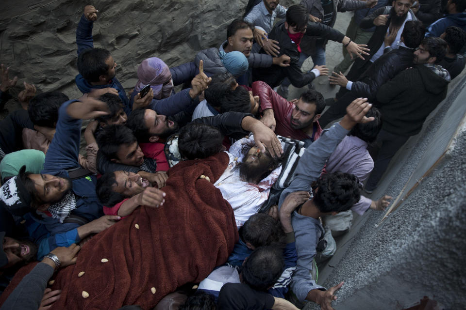 Kashmiri men shout pro-freedom slogans as they carry body of Mehraj-Ud-Din Bangroo, a rebel commander during his funeral in Srinagar, India, Wednesday, Oct. 17, 2018. Anti-India protests and clashes erupted in the main city in disputed Kashmir on Wednesday after a gunbattle between militants and government forces killed at least two suspected rebels, a civilian and a counterinsurgency police official, residents and police said. (AP Photo/Dar Yasin)