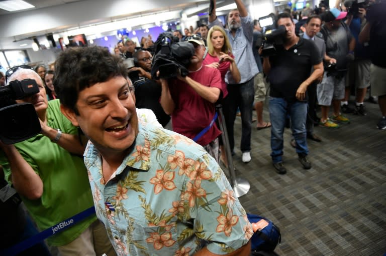 Passenger Seth Miller of New York boards a JetBlue flight to Cuba on August 31, 2016 in Fort Lauderdale, Florida