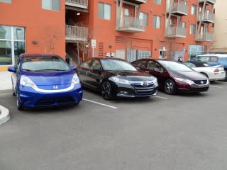 Green vehicles parked across from Honda Smart Home at UC-Davis, California