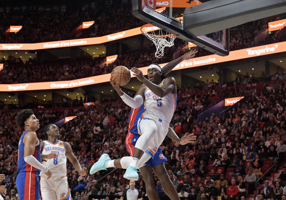 Oct 12, 2023; Montreal, Quebec, CAN; Oklahoma City Thunder guard Luguentz Dort (5) drives to the net during the second quarter of the game against the Detroit Pistons at the Bell Centre. Mandatory Credit: Eric Bolte-USA TODAY Sports