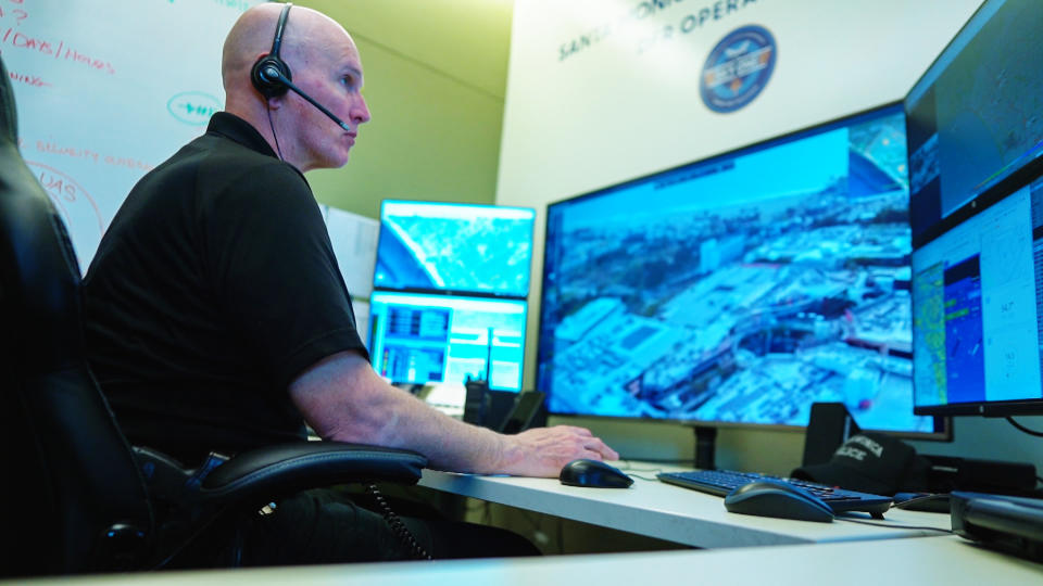 Officer Peter Lashley controls the department’s drone at a command center inside the police station. (Ray Farmer / NBC News)