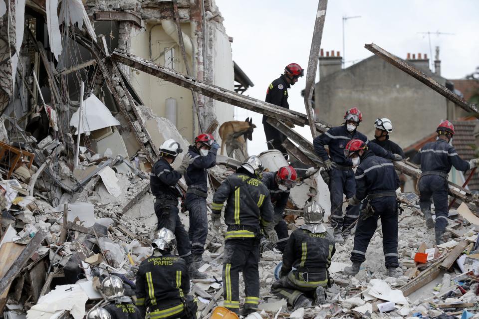 French firefighters search the rubble of a collapsed building in Rosny-Sous-Bois, near Paris August 31, 2014. (REUTERS/Christian Hartmann)