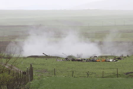 An Armenian artillery unit is seen in the town of Martakert, where clashes with Azeri forces are taking place, in Nagorno-Karabakh region, which is controlled by separatist Armenians, April 3, 2016. REUTERS/Vahram Baghdasaryan/Photolure