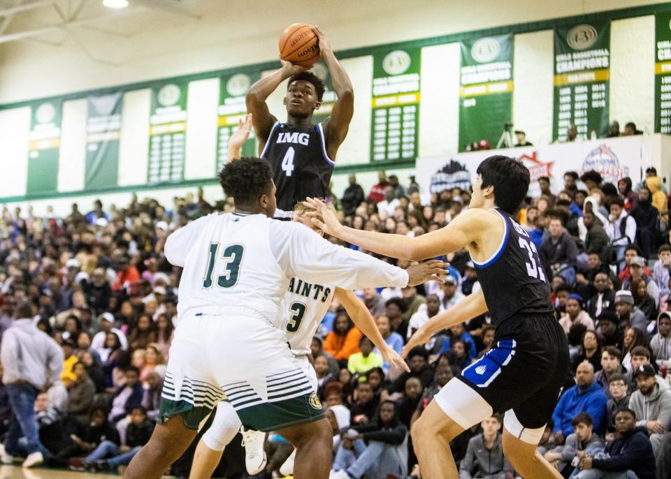 IMG forward Brandon Huntley-hatfield (4) shoots the ball over Briarcrest's center Rodney Newsome (13) during the National Hoopfest on Jan. 4, 2020 in Eads, TN.