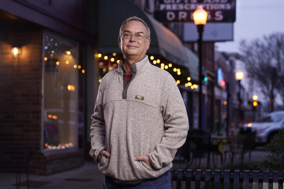 Cole Shepherd poses on the town square in Gallatin, Tenn., Jan. 11, 2021. A centrist Democrat, he voted for Biden, thinking the former vice president might repair relations with U.S. allies. "The Republican Party has moved so far to the right." (AP Photo/Mark Humphrey)