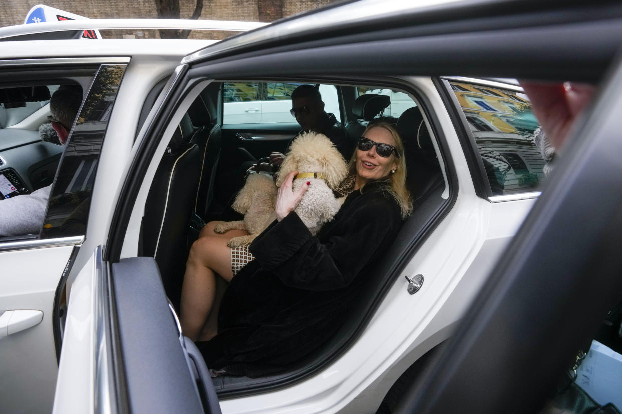 Texas-born Princess Rita Boncompagni Ludovisi, born Rita Jenrette Carpenter and last wife of late Prince Nicolo Boncompagni Ludovisi, sits in a taxi as she leaves her residence, The Casino dell'Aurora, also known as Villa Ludovisi, during the execution of an eviction order, in Rome, Thursday, April 20, 2023. The villa contains the only known ceiling painted by Caravaggio and Princess Ludovisi is facing a court-ordered eviction Thursday, in the latest chapter in an inheritance dispute with the heirs of one of Rome's aristocratic families. (AP Photo/Andrew Medichini)