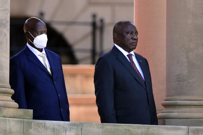 Ugandan President, Yoweri Museveni, left, and his South African counterpart Cyril Ramaphosa, look on during a welcoming ceremony in Pretoria, South Africa, Tuesday, Feb. 28, 2023. Museveni's visit is directed at consolidating bilateral relations between the two countries, with discussions between the two Heads of State encompassing political, economic, regional, continental and international issues. (AP Photo)