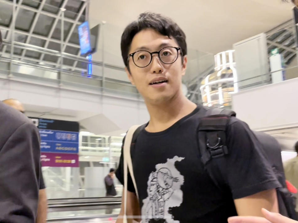 Japanese filmmaker Toru Kubota walks at an airport on the outskirts of Bangkok, Thailand Thursday, Nov. 17, 2022, as he arrived from Myanmar. Myanmar's military-controlled government announced Thursday it was releasing and deporting Kubota, an Australian academic, an ex-British diplomat and an American as part of a broad prisoner amnesty marking the country’s National Victory Day.(Kyodo News via AP)