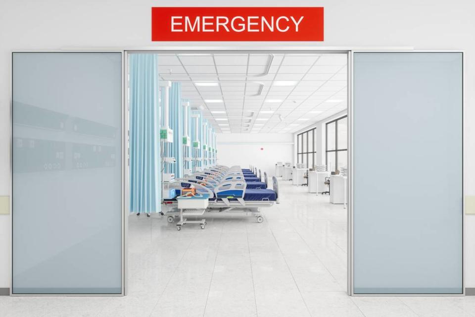 Hospital Gurneys And Nurse Stations In The Emergency Room With Emergency Sign