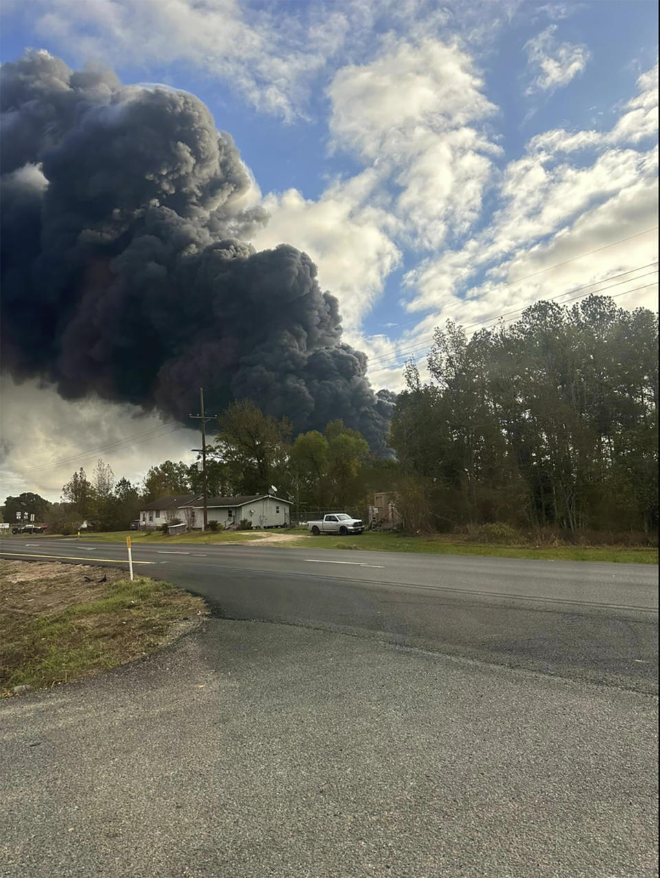 In this photo provided by Janay Jones, smoke fills the sky from a chemical plant fire in Shepherd, Texas on Thursday, Nov. 8, 2023. Authorities issued a shelter in place order for the Texas residents within a one-mile radius of the chemical plant fire Wednesday. (Janay Jones via AP)
