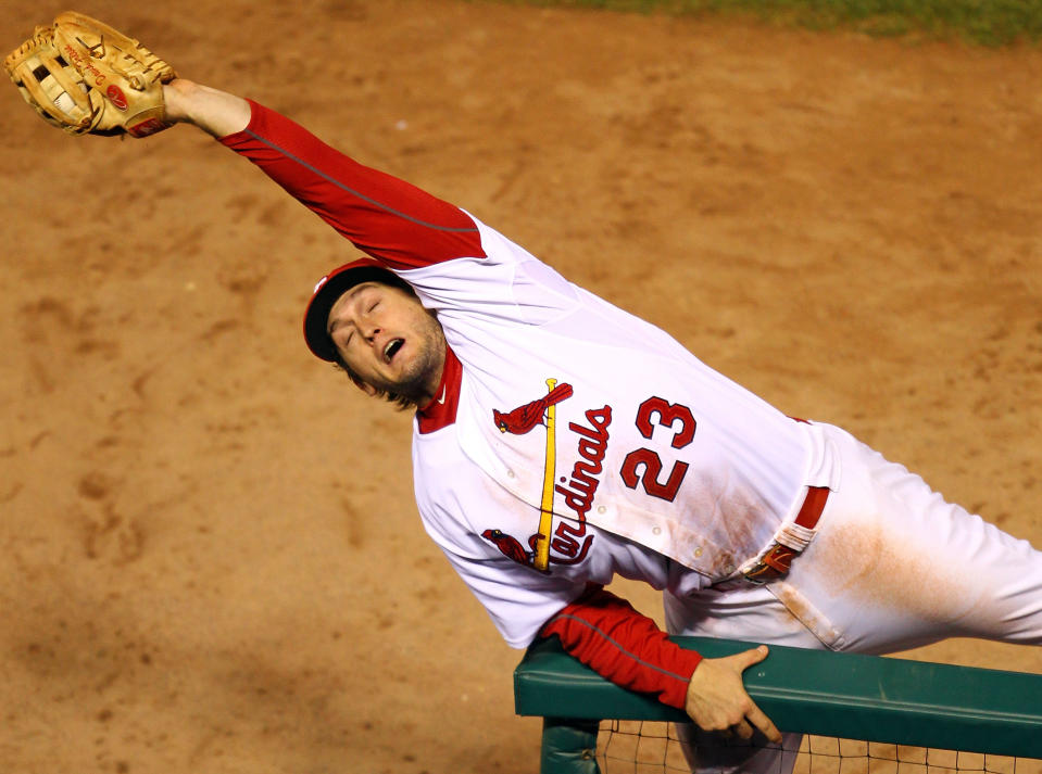 ST LOUIS, MO - OCTOBER 28: David Freese #23 of the St. Louis Cardinals catches a foul ball by Josh Hamilton #32 of the Texas Rangers in the fifth inning during Game Seven of the MLB World Series at Busch Stadium on October 28, 2011 in St Louis, Missouri. (Photo by Dilip Vishwanat/Getty Images)